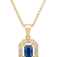 Gold-tone gemstone pendant necklace with blue sapphire-style stone and crystal halo