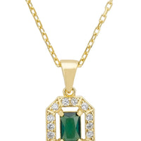 Gold gemstone pendant necklace with emerald green center and diamond halo