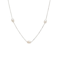 White gold spaced pearl necklace with natural pearls along the chain