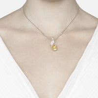 Silver chain necklace with small bird pendant and teardrop yellow gemstone