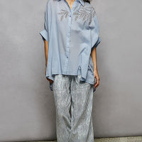 Sky blue button-down embroidered high-low hem shirt with front button placket