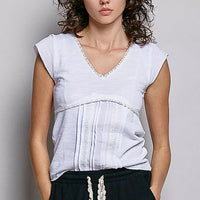 Off-white textured knit V-neck short-sleeve top with lace-trim detail at neckline