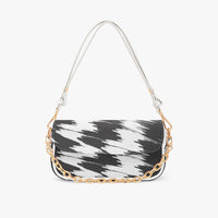 Black and white cowprint shoulder bag with gold chain and white strap, half-moon shape