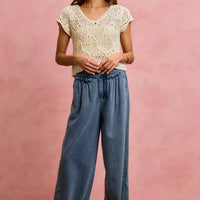 Women's denim wide-leg jeans with ruffled elastic waist and button front closure