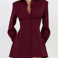 Wine red blazer mini dress with notched collar, long sleeves, and row of round buttons.