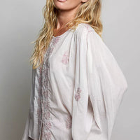 Embroidered gathered-shoulder long-sleeve shirt in off-white with blush floral embroidery
