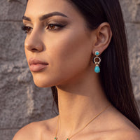 Turquoise enamel drop earrings with gold-tone rings and blue teardrop drops