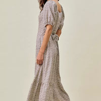 Ditsy floral midi dress in off-white with black speckles, side view, elastic waist belt