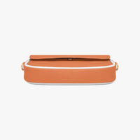 Orange flap shoulder bag with slim top edge and minimal front detailing