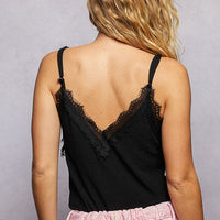 Back view of black lace-trim ribbed cami with V-neck and spaghetti straps