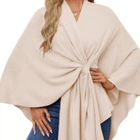 Women’s ivory shawl cape with draped V-neck and front tie detail over jeans