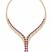 Gold-tone rhinestone necklace with ruby red marquise stones and long V-drop pendant