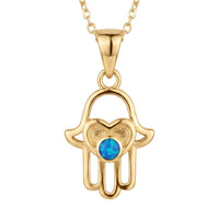 Gold hamsa hand pendant necklace with blue opal-style center, on a chain