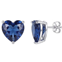 Sapphire-blue heart stud earrings with silver hinged backing, side view