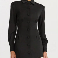 Black blazer mini dress with pointed collar and vertical row of round buttons.