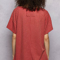 Terra cotta ribbed knit V-neck t-shirt back view with side slit