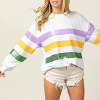 White sweatshirt with sequin horizontal stripes in purple, yellow, and green, long sleeves
