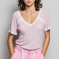 Baby pink textured V-neck T-shirt with white lace trim and short sleeves
