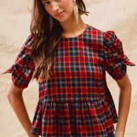 Red plaid peplum top with ribbon-tied short puff sleeves