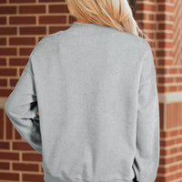 Gray mock-neck pullover sweatshirt back view with relaxed long sleeves