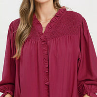 Mulberry mini dress close-up of smocked ruffle V-neck and button placket