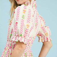 Cream smocked midi dress with bright chevron print, puff sleeves, ruffle cuffs