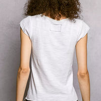 Off-white textured knit top, back view, short sleeves and scoop yoke seam