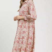 Tiered midi dress with pink botanical print, long sleeves, shown in side profile