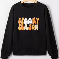 Black long-sleeve crewneck sweatshirt with embroidered “Spooky Season” graphic
