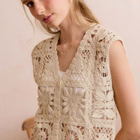 Natural crochet patterned sleeveless vest top with V-neck and button closure, oval lace panels