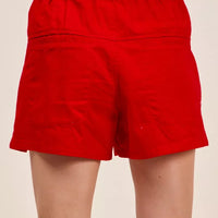 Red twill denim shorts with pintucked back yoke and elastic waistband.