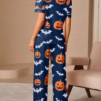 Navy pajama set with back button-up top and long lounge pants, pumpkin and bat print