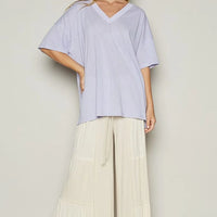 Lilac V-neck half-sleeve T-shirt with wide drape hem and relaxed silhouette