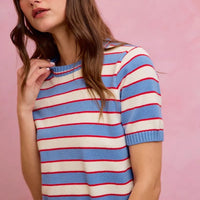 Striped knit crew neck short-sleeve sweater top in blue, red, and white; ribbed collar