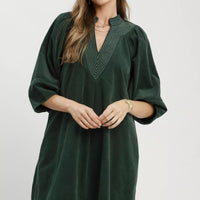 Hunter green corduroy V-neck shift dress with puff sleeves and side pockets