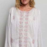 Embroidered gathered-shoulder long-sleeve shirt in off-white with blush floral placket
