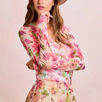 Floral mesh cardigan top in pink multi with V-neck, buttons, and tie drawstring hem
