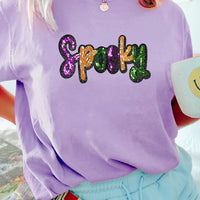Lavender T-shirt with sequined 'Spooky' front graphic in purple, orange, and green