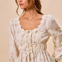 White floral clip-dot blouse with scalloped lace neckline, ruched center, and gathered waist