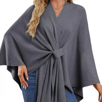 Dark gray women’s cape shawl with front tie knot and flowing poncho drape