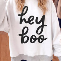 Reversible white mock neck tunic sweatshirt with "hey boo" black script front
