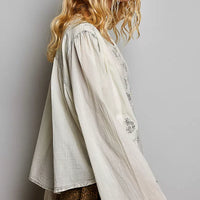 Pale grey embroidered button-front woven shirt with floral motifs, long loose sleeves