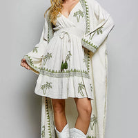 Natural palm tree print wrap dress with smocked waist, tiered ruffle hem