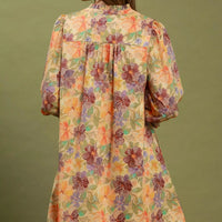 Floral print mini dress back view with gathered yoke and smocked cuffs