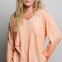 Peach V-neck lightweight knit long-sleeve top with contrast trim and chest pocket