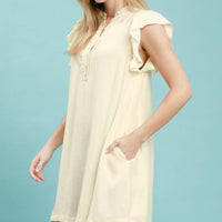 Cream ruffle-sleeve henley shift dress, short length, partial side view
