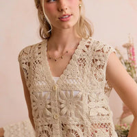 Crochet sleeveless vest top with floral lace pattern and button front