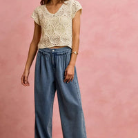 Women's mid-rise denim wide-leg jeans with ruffled elastic waistband and roomy legs