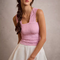 White denim bubble skort with smocked waistband and flared mini skirt hem
