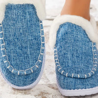 Light blue faux fur lined round toe slip-on shoes, side view with white trim